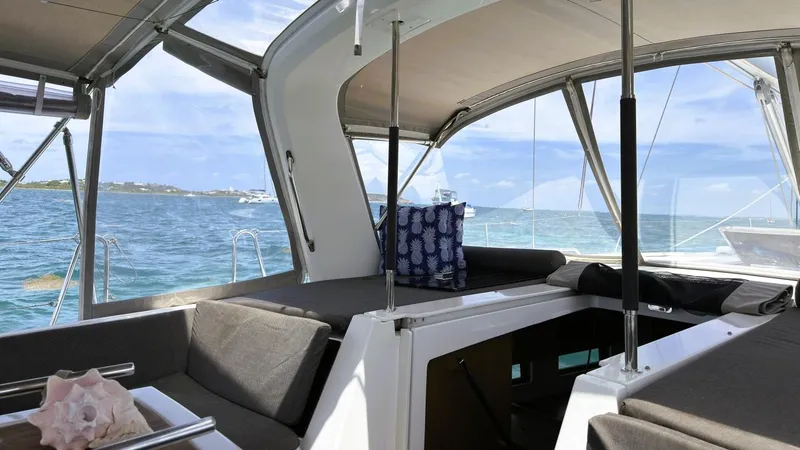 Batesea Yacht Photos Pics 2020 Beneteau Oceanis 46.1 yacht interior with ocean view, featuring comfortable seating and modern design.