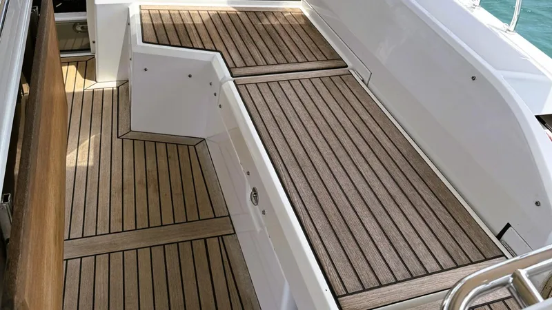 Batesea Yacht Photos Pics Teak deck of 2020 Beneteau Oceanis 46.1 yacht, showcasing elegant wood finish.