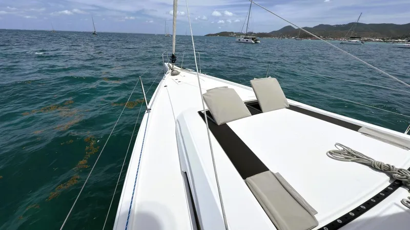 Batesea Yacht Photos Pics 2020 Beneteau Oceanis 46.1 sailboat on open sea with scenic coastal view.