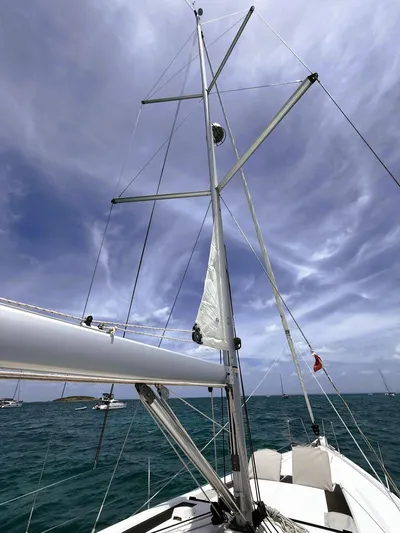 Batesea Yacht Photos Pics Sailing yacht Beneteau Oceanis 46.1, 2020 model, with mast and sails against cloudy sky.