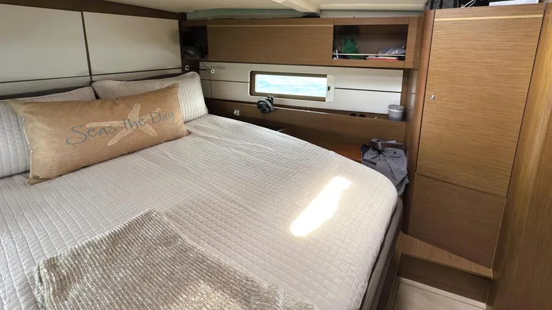 Batesea Yacht Photos Pics Luxurious cabin interior of 2020 Beneteau Oceanis 46.1 yacht with cozy bedding.