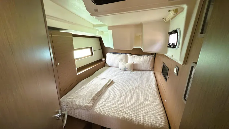 Batesea Yacht Photos Pics Cozy cabin interior of 2020 Beneteau Oceanis 46.1 yacht with comfortable bedding.