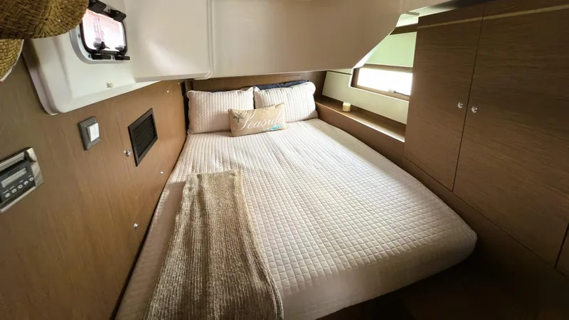 Batesea Yacht Photos Pics Cozy cabin interior of 2020 Beneteau Oceanis 46.1 yacht with comfortable bedding.