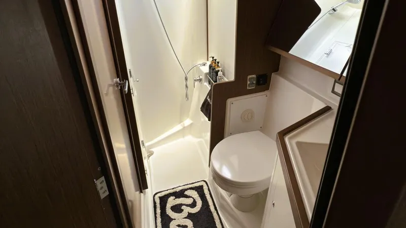 Batesea Yacht Photos Pics Bathroom interior of 2020 Beneteau Oceanis 46.1 yacht, featuring shower and toilet.