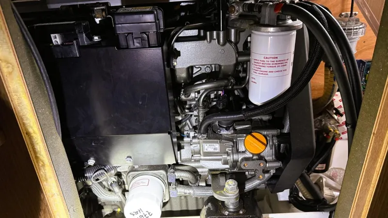 Batesea Yacht Photos Pics Engine compartment of a 2020 Beneteau Oceanis 46.1 sailboat, showcasing mechanical components.