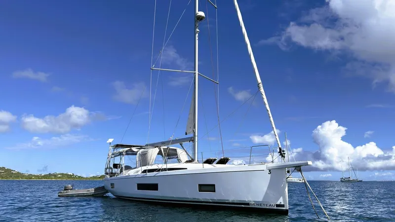Batesea Yacht Photos Pics 2020 Beneteau Oceanis 46.1 sailboat on calm sea under blue sky.