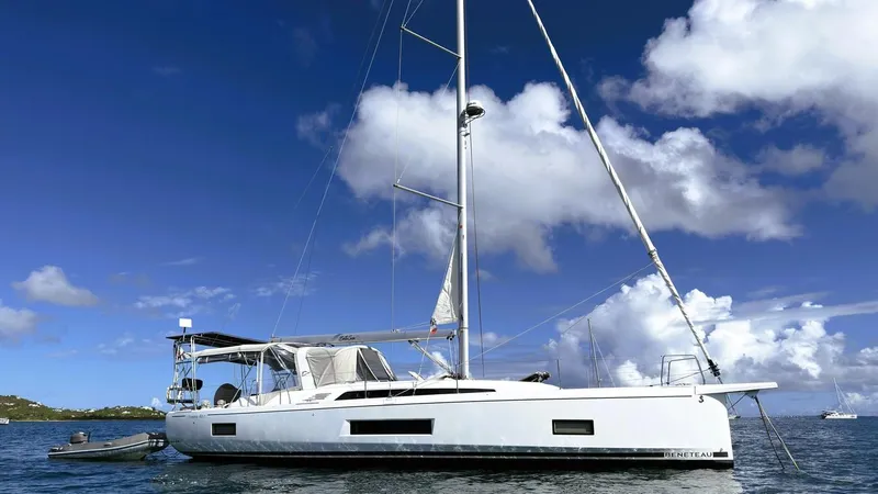 Batesea Yacht Photos Pics 2020 Beneteau Oceanis 46.1 sailboat on calm water under a clear blue sky.