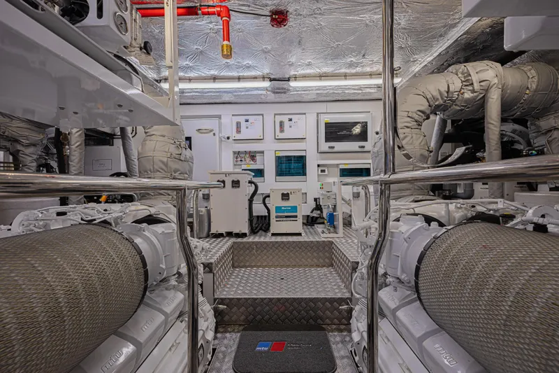 Hideout Yacht Photos Pics Engine room of 2025 Sunseeker 88 Yacht, showcasing advanced machinery and equipment.