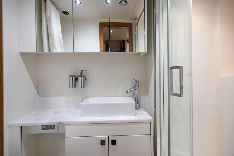 Hideout Yacht Photos Pics Luxurious bathroom in 2025 Sunseeker 88 Yacht with modern fixtures and sleek design.