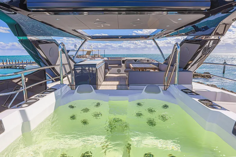 Hideout Yacht Photos Pics Luxurious 2025 Sunseeker 88 Yacht with jacuzzi and ocean view.