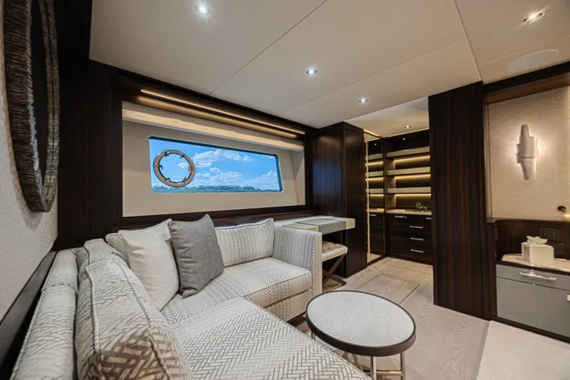 Hideout Yacht Photos Pics Luxurious interior of 2025 Sunseeker 88 Yacht with elegant seating and modern design.