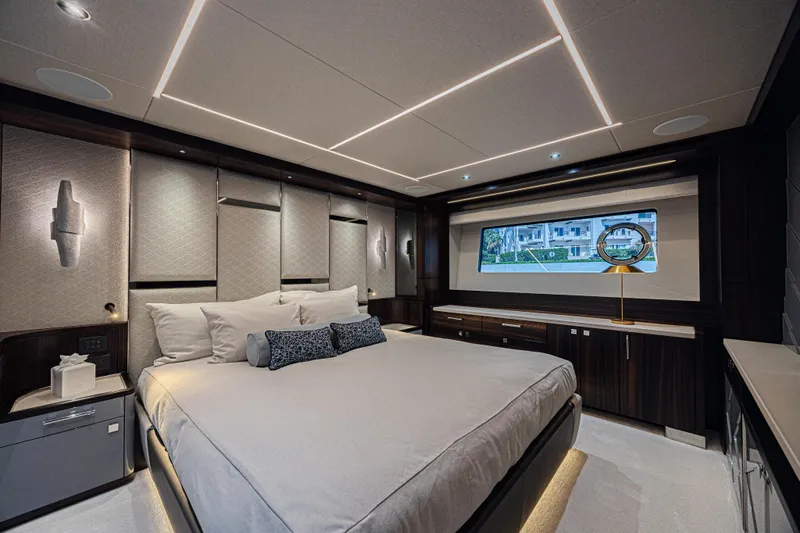 Hideout Yacht Photos Pics Luxurious bedroom interior of 2025 Sunseeker 88 Yacht with modern design and elegant lighting.