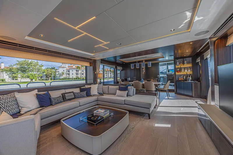 Hideout Yacht Photos Pics Luxurious interior of 2025 Sunseeker 88 Yacht with modern furnishings and elegant lighting.