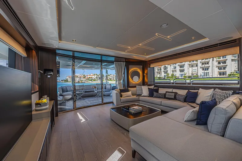 Hideout Yacht Photos Pics Luxurious interior of 2025 Sunseeker 88 Yacht with modern decor and spacious seating.
