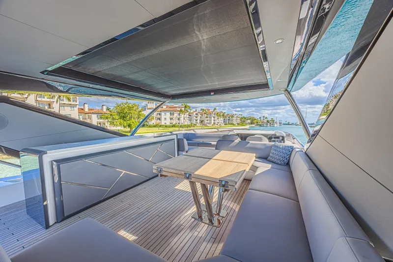 Hideout Yacht Photos Pics Luxurious Sunseeker 88 Yacht 2025 interior with elegant seating and scenic waterfront view.