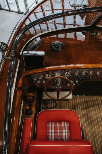  Yacht Photos Pics Luxurious 2026 J Craft Torpedo 42 yacht interior with polished wood and red plaid seating.