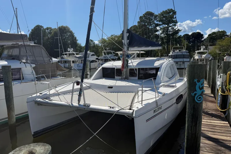  Yacht Photos Pics 2012 Leopard 39 catamaran docked at marina under clear blue sky.