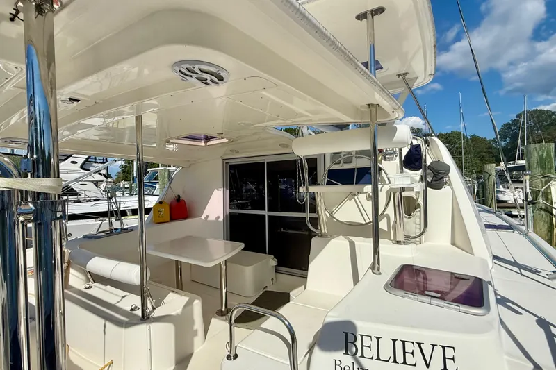  Yacht Photos Pics 2012 Leopard 39 yacht interior with seating and table, docked at marina.