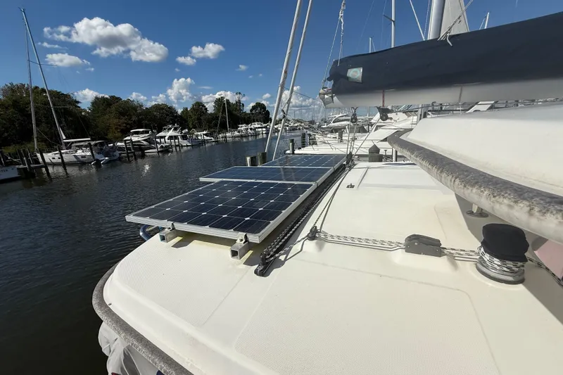  Yacht Photos Pics 2012 Leopard 39 yacht with solar panels docked at marina under blue sky.