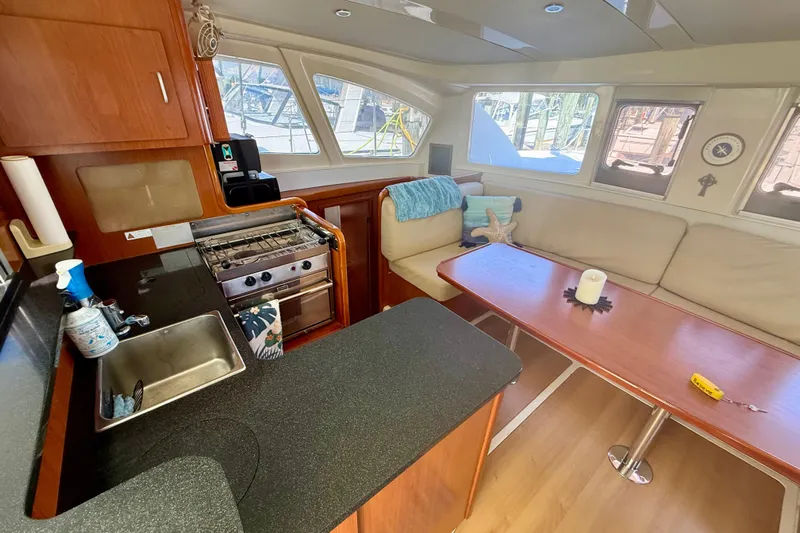  Yacht Photos Pics Interior of 2012 Leopard 39 yacht with kitchen and seating area.