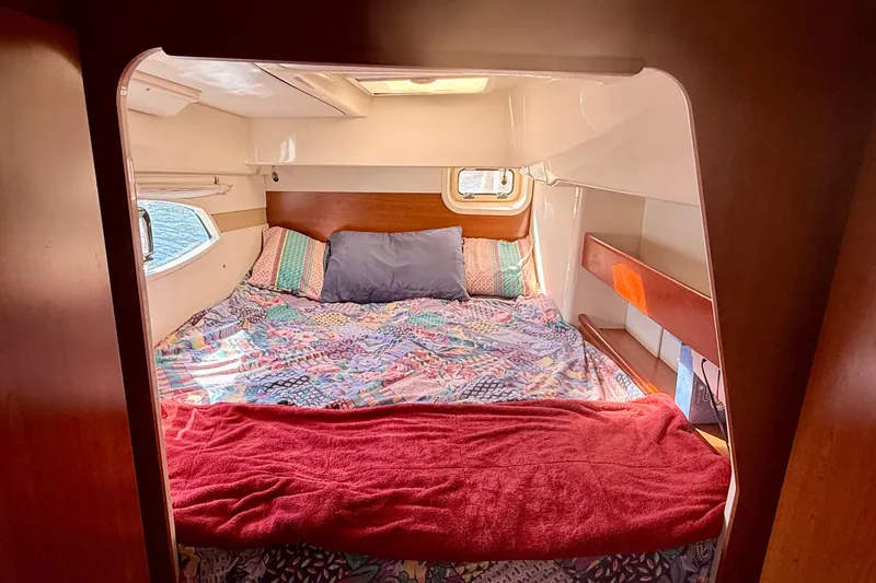  Yacht Photos Pics Cozy cabin interior of 2012 Leopard 39 yacht with colorful bedding and window view.