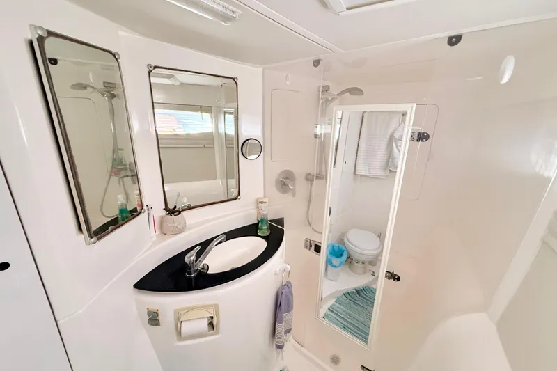  Yacht Photos Pics Modern bathroom in 2012 Leopard 39 yacht with sink, mirrors, and shower.