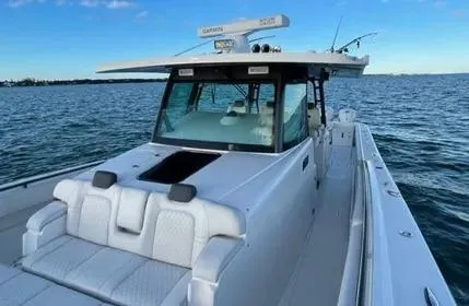  Yacht Photos Pics 2019 HCB 53 Sue&ntilde;os boat on calm water, featuring sleek design and spacious deck.