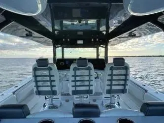 Yacht Photos Pics 2019 HCB 53 Sue&ntilde;os boat interior with three seats, ocean view, and modern design.