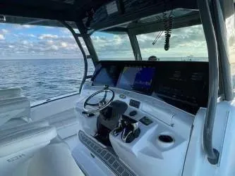  Yacht Photos Pics 2019 HCB 53 Sue&ntilde;os boat cockpit with ocean view, featuring modern controls and seating.