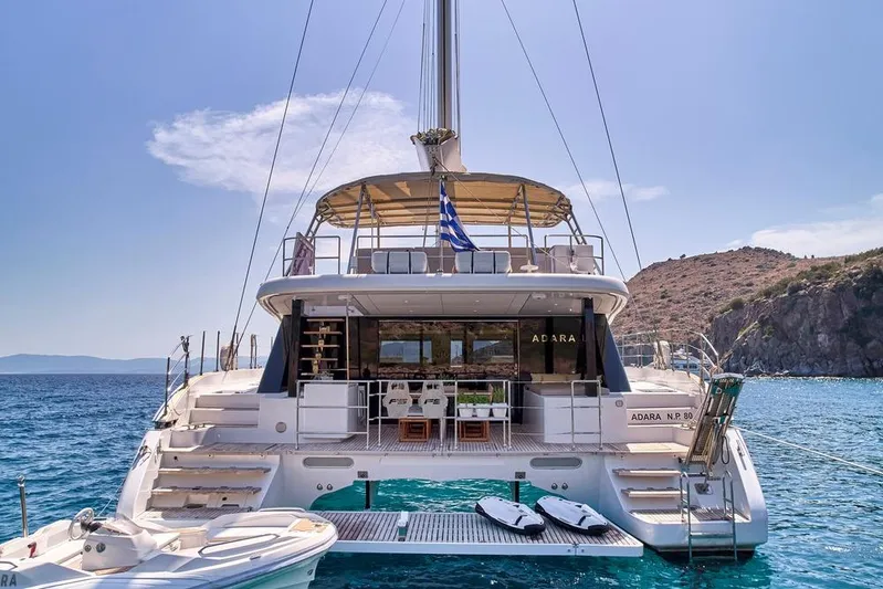 Adara Yacht Photos Pics Luxurious 2020 Sunreef 50 yacht anchored in scenic coastal waters.