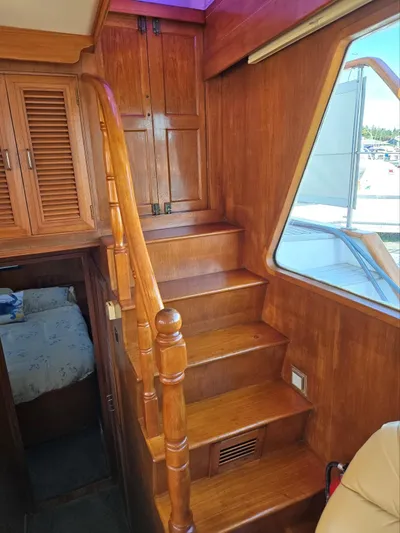 Blue Agave Yacht Photos Pics Wooden staircase and cabin interior of 1983 Ocean Alexander 43 Flush Aft Deck yacht.