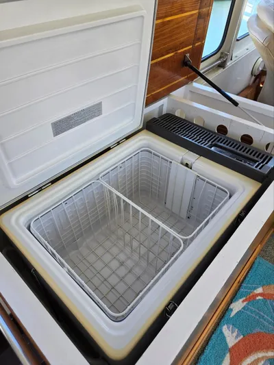 Blue Agave Yacht Photos Pics Open freezer compartment on 1983 Ocean Alexander 43 Flush Aft Deck yacht.