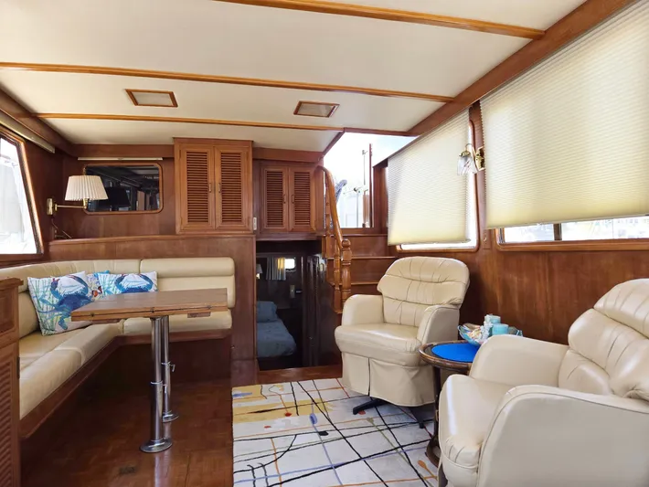 Blue Agave Yacht Photos Pics Luxurious 1983 Ocean Alexander 43 yacht interior with plush seating and elegant wood finishes.