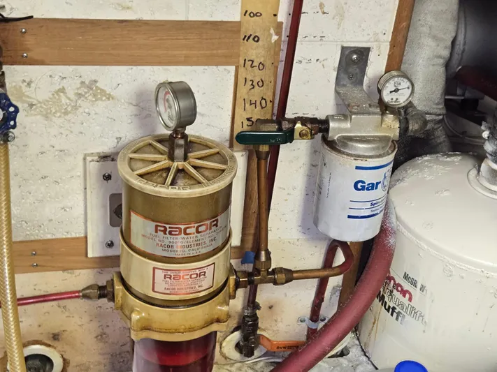 Blue Agave Yacht Photos Pics Engine room of 1983 Ocean Alexander 43 with Racor fuel filter and pressure gauge.