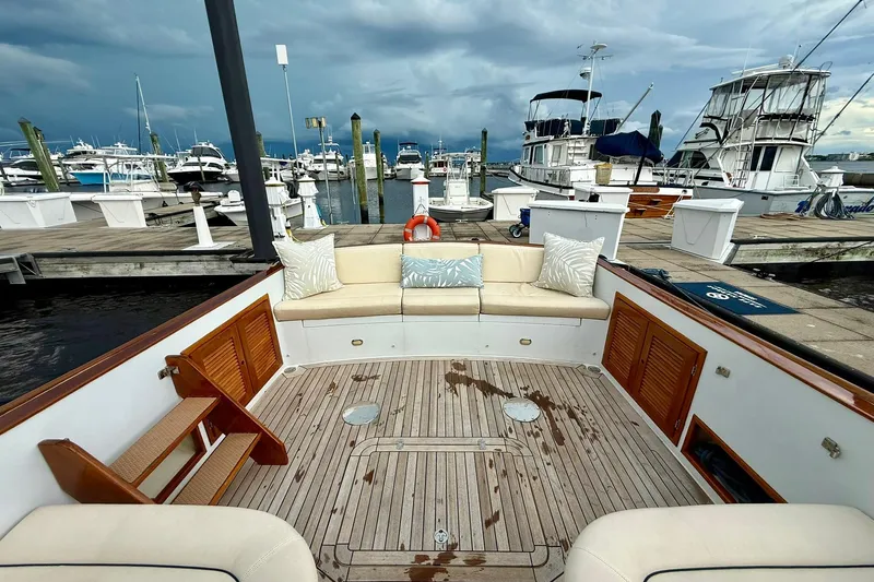  Yacht Photos Pics Luxurious 2001 San Juan 38 yacht interior with elegant seating at a marina.