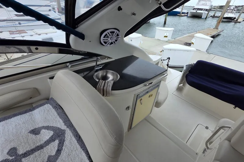  Yacht Photos Pics Interior of a 2002 Regal Commodore 4260 yacht with sink and seating area.