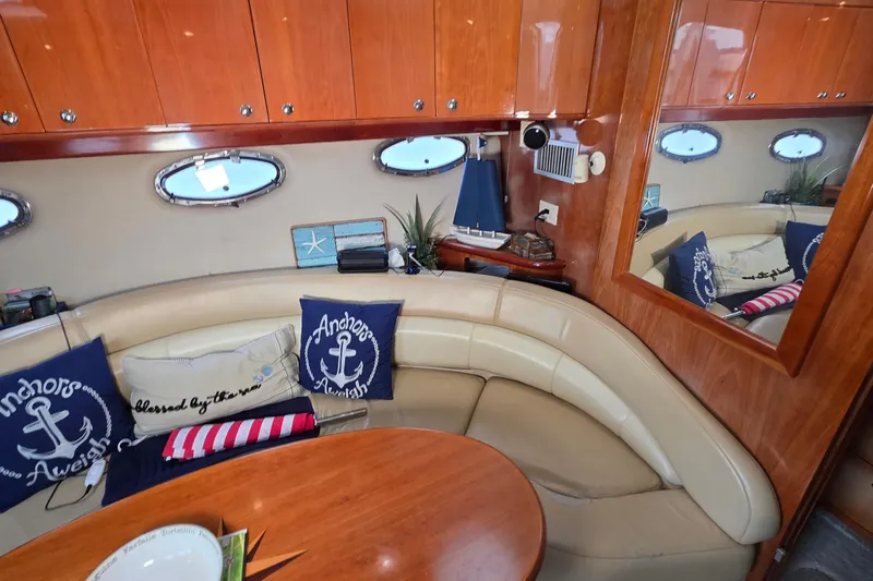  Yacht Photos Pics Luxurious 2002 Regal Commodore 4260 yacht interior with nautical decor and plush seating.
