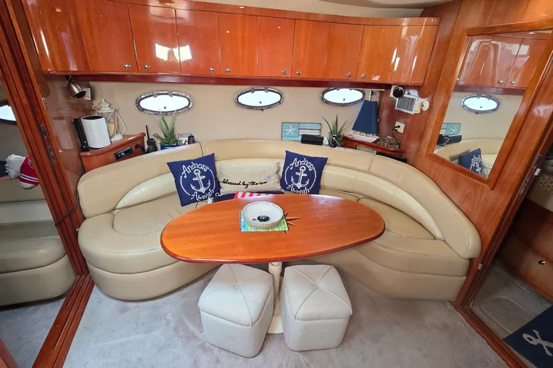  Yacht Photos Pics Luxurious interior of 2002 Regal Commodore 4260 yacht with leather seating and wooden accents.