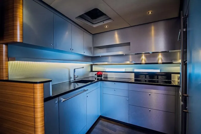  Yacht Photos Pics Modern kitchen interior on 2011 Acico 74 yacht, featuring sleek cabinetry and ambient lighting.