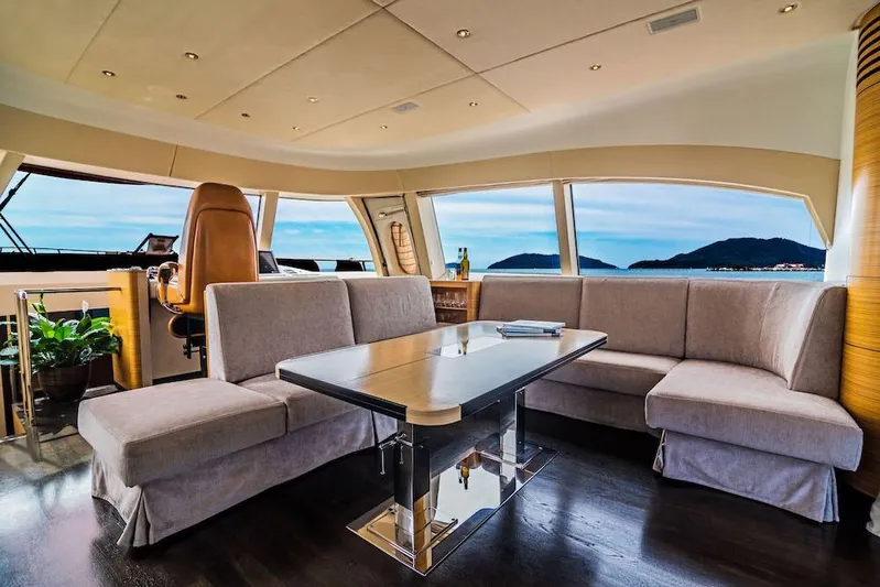  Yacht Photos Pics Luxurious interior of 2011 Acico 74 yacht with panoramic ocean views and elegant seating.