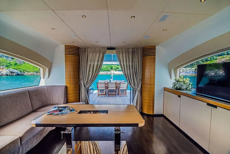  Yacht Photos Pics Luxurious interior of 2011 Acico 74 yacht with elegant furnishings and scenic ocean view.