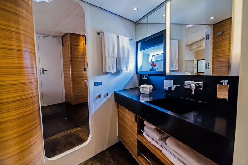  Yacht Photos Pics Luxurious bathroom interior of 2011 Acico 74 yacht with modern fixtures and wooden accents.