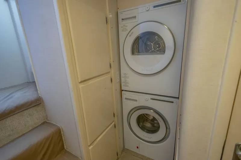  Yacht Photos Pics Stacked washer and dryer in 1987 Hatteras 70 Cockpit Motor Yacht interior.