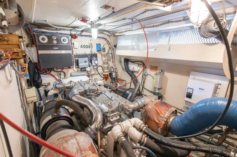  Yacht Photos Pics Engine room of 1987 Hatteras 70 Cockpit Motor Yacht with complex machinery and wiring.