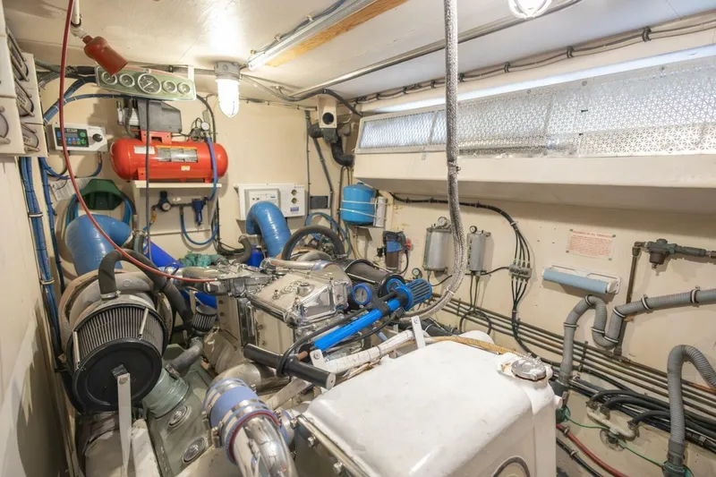  Yacht Photos Pics Engine room of 1987 Hatteras 70 Cockpit Motor Yacht, showcasing mechanical components and systems.