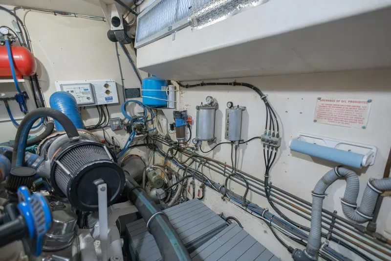  Yacht Photos Pics Engine room of 1987 Hatteras 70 Cockpit Motor Yacht with visible machinery and wiring.