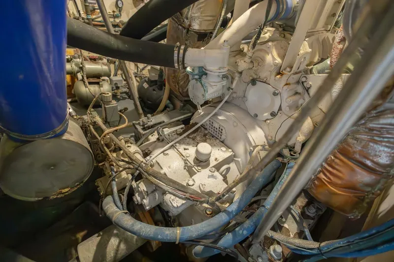  Yacht Photos Pics Engine room of 1987 Hatteras 70 Cockpit Motor Yacht with visible machinery and hoses.