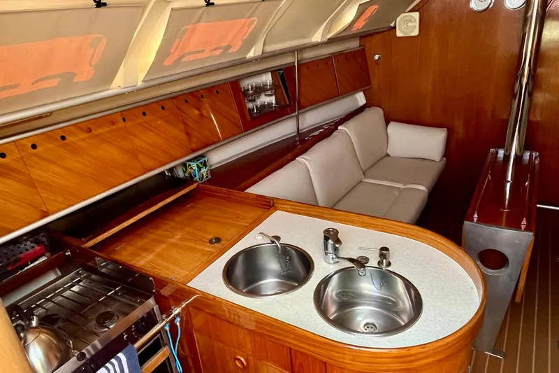 Marianne Yacht Photos Pics Interior of 1991 Beneteau First 38s5 yacht with kitchen and seating area.