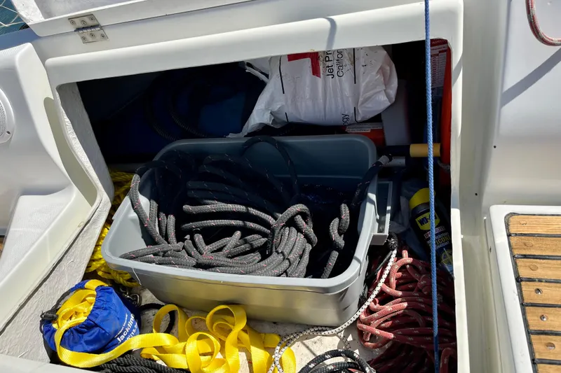 Marianne Yacht Photos Pics Storage compartment on a 1991 Beneteau First 38s5 sailboat with ropes and supplies.