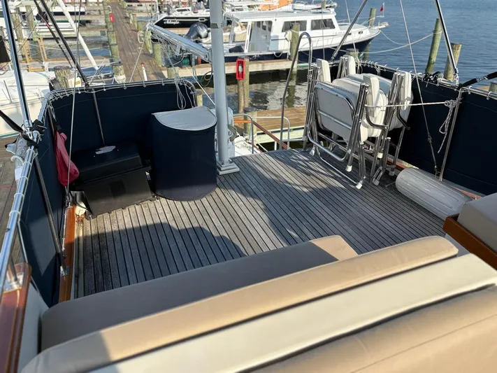  Yacht Photos Pics Flybridge of 1986 Grand Banks 36 Classic yacht with seating and marina view.